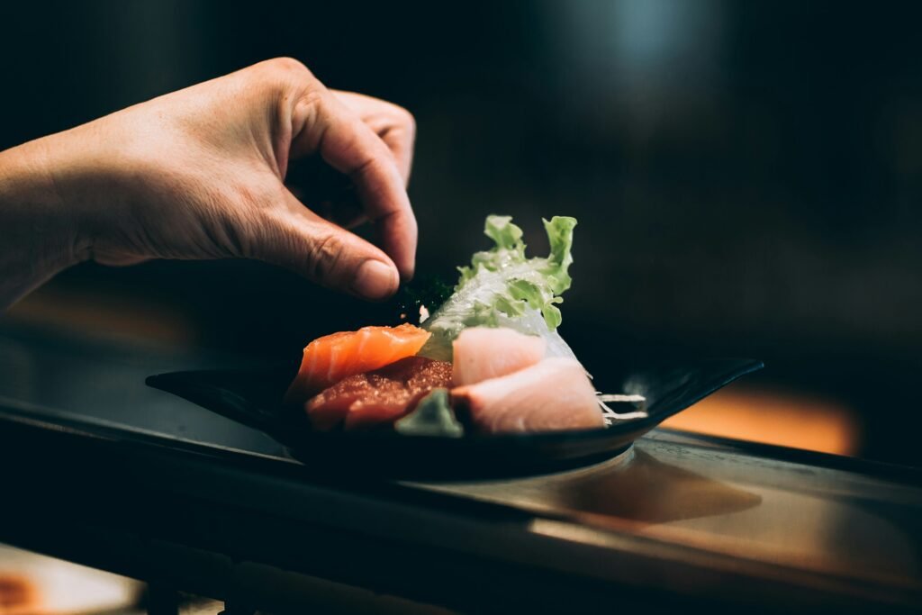 Why Red Lobster Restaurant Chain is Closing Down Their Outlets? left hand picking vegetable on plate