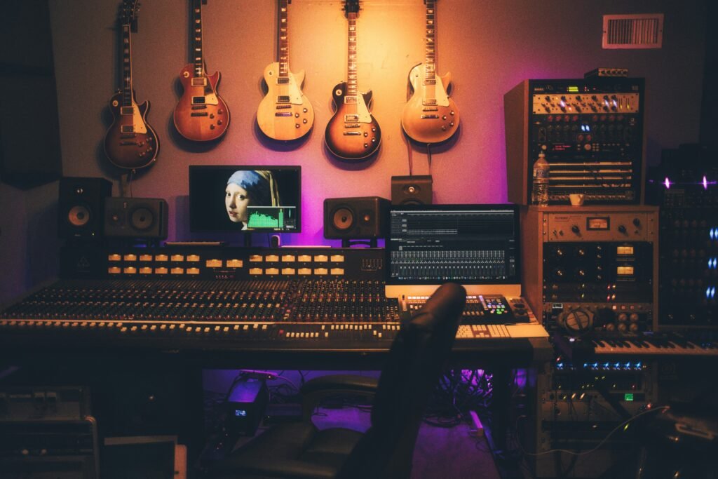 The Role of Music in Film person playing brown and white acoustic guitars